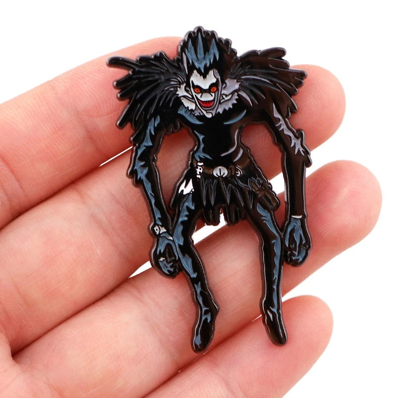 THE BORED SHINIGAMI Pin held in hand for size
