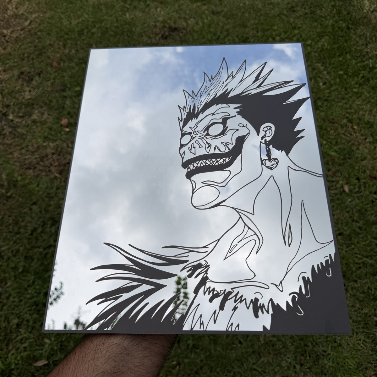 The Bored Shinigami Mirror, Death Note wall mirror, held in hand for scale