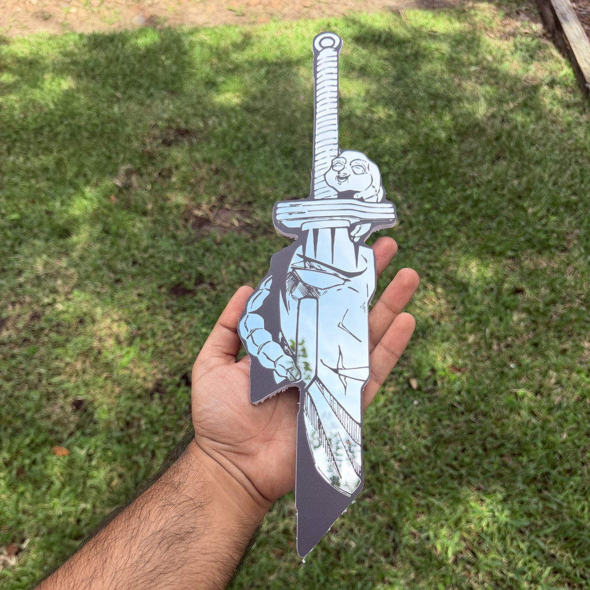 The Dragonslayer Mirror, Berserk wall mirror, held in hand for scale