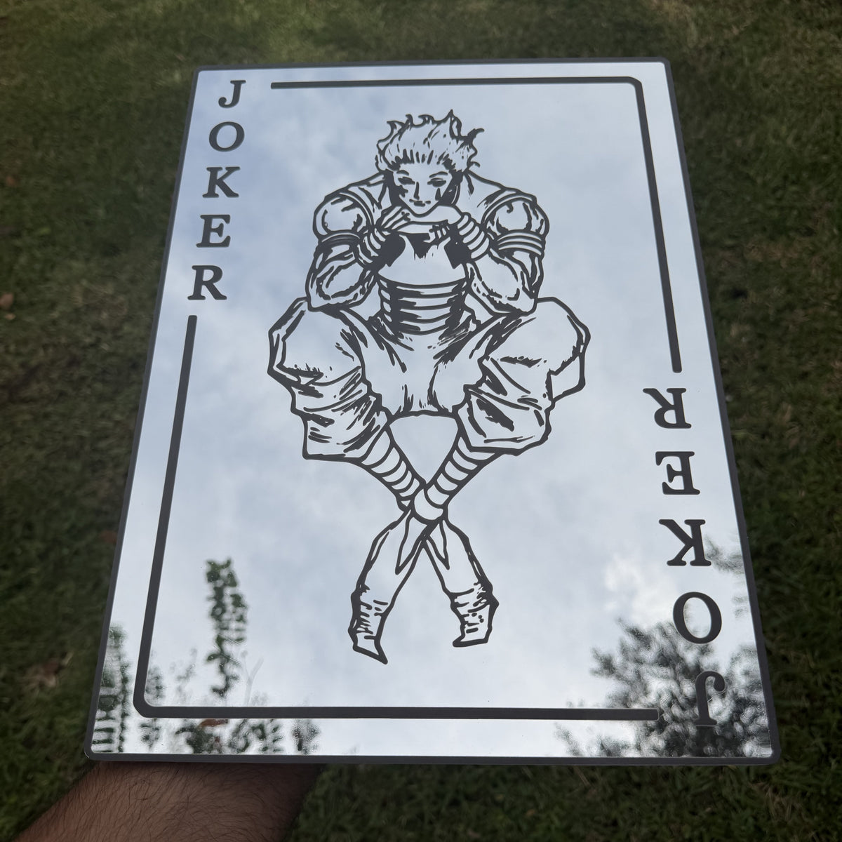 The Joker Card Mirror, Hunter x Hunter wall mirror, held in hand for scale